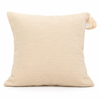 Coussin crème en coton naturel à pompons