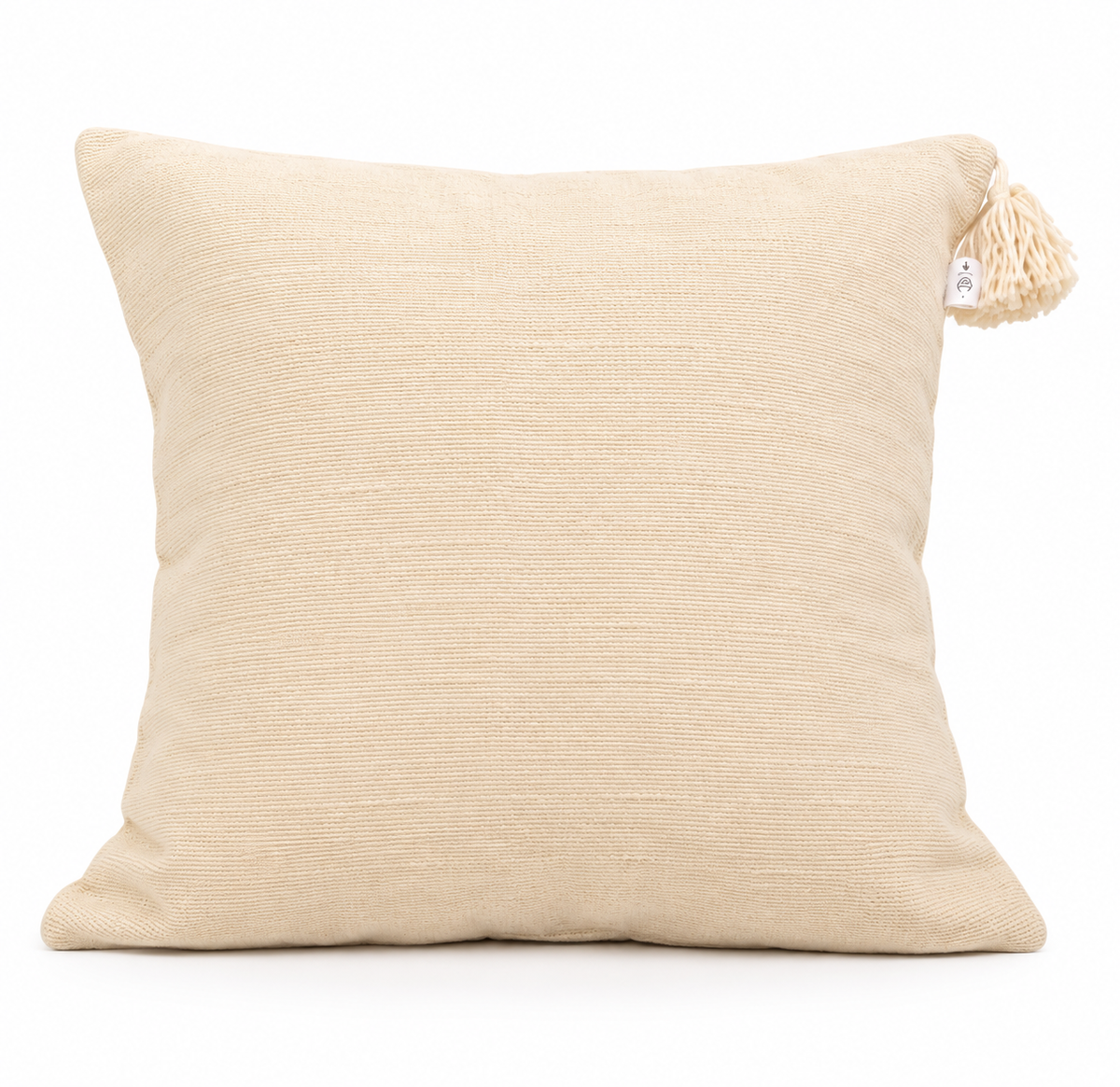 Coussin crème en coton naturel à pompons